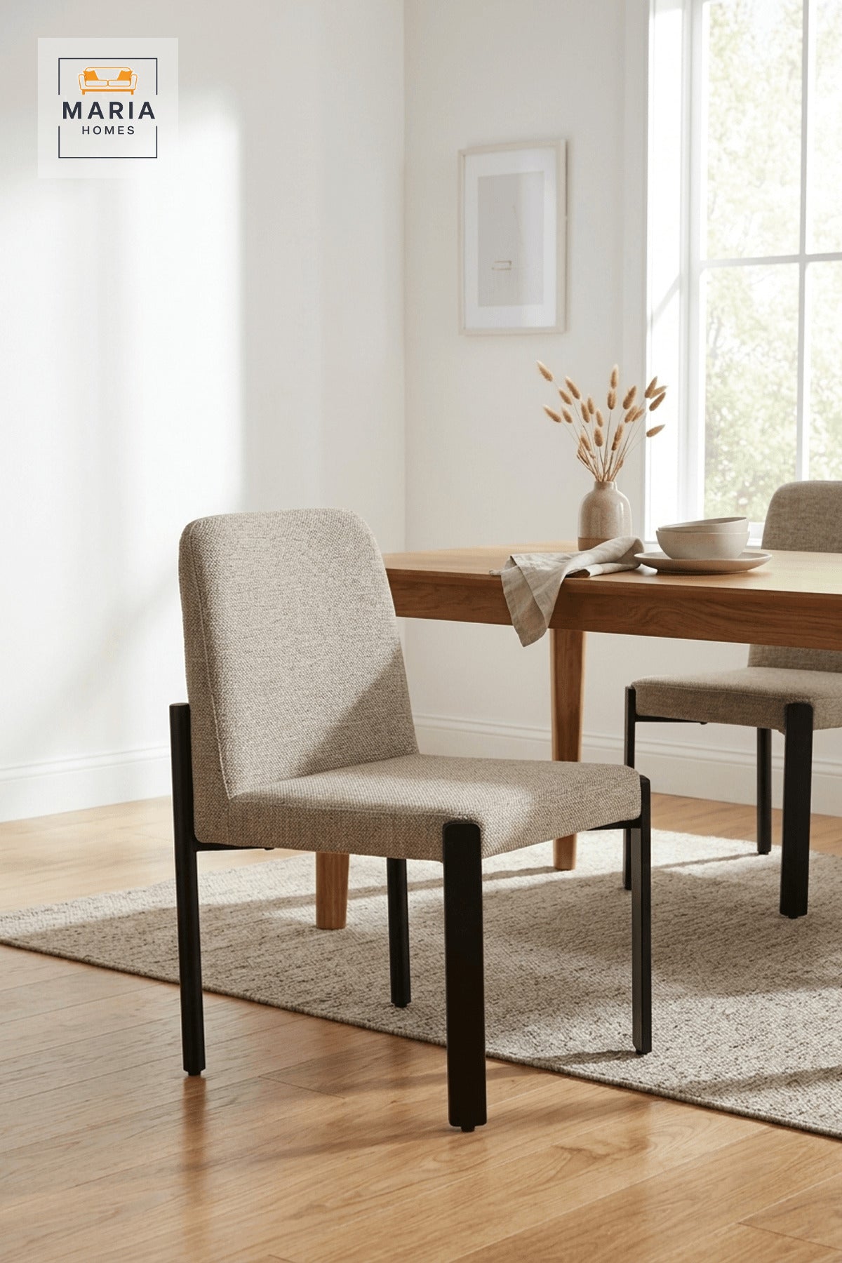 Beige Upholstered Dining Chair with Black Metal Legs for Home Dining Spaces