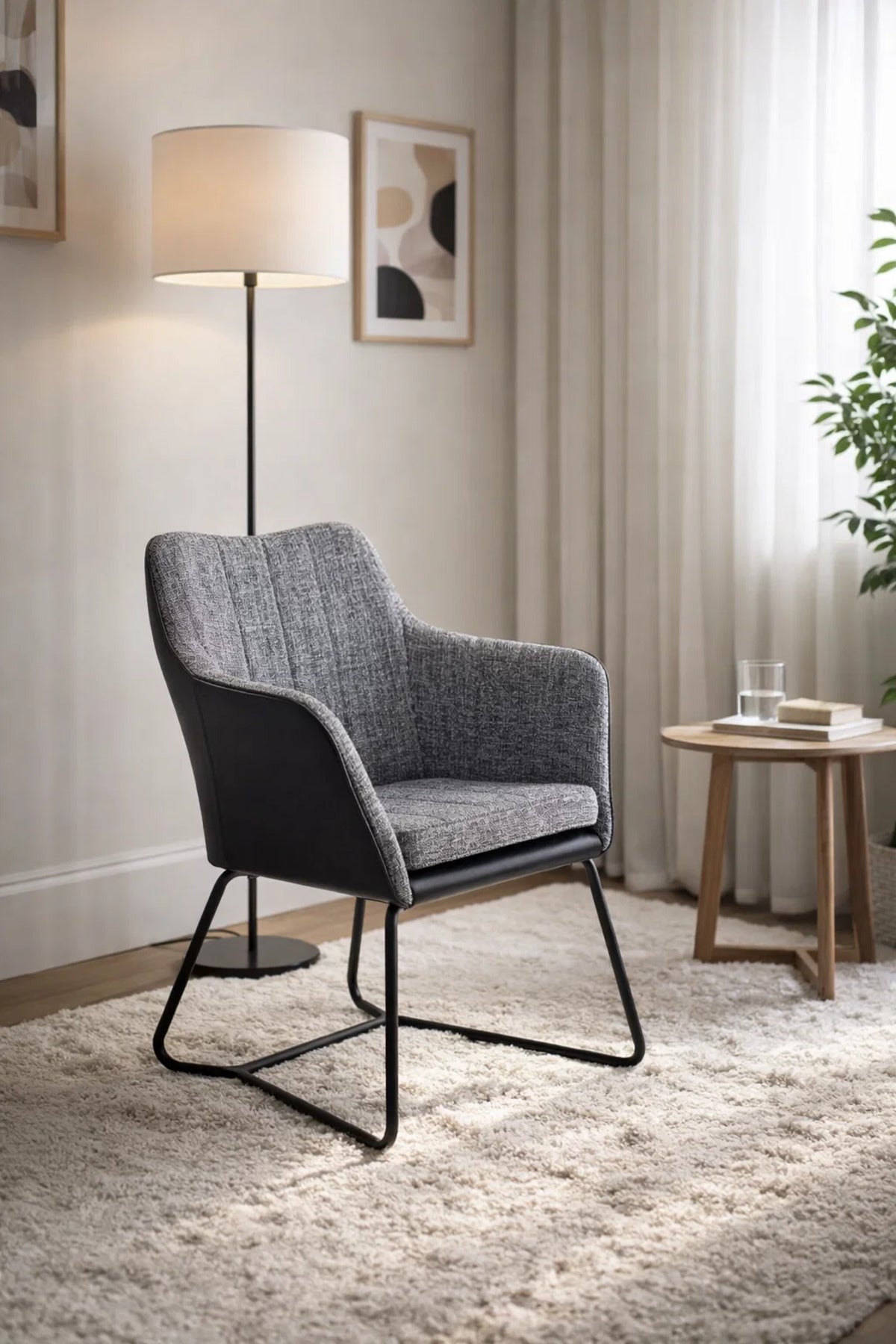 Contemporary Grey Fabric Dining Chair with Black Leather Back and Sled Legs for Modern Interiors