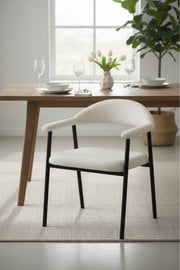 Modern Beige Upholstered Dining Chair with Curved Back & Black Metal Legs