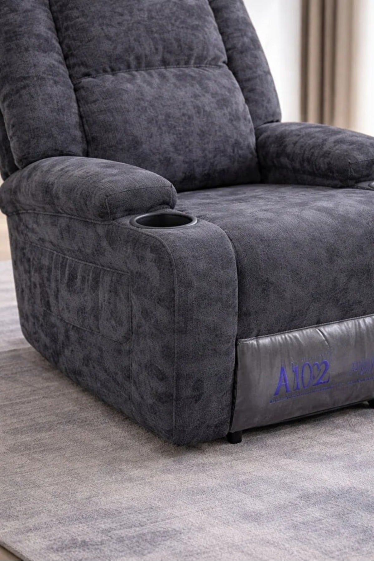Comfortable adjustable recliner chair in gray with footrest