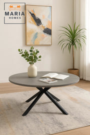Grey stone round coffee table with angled black metal legs