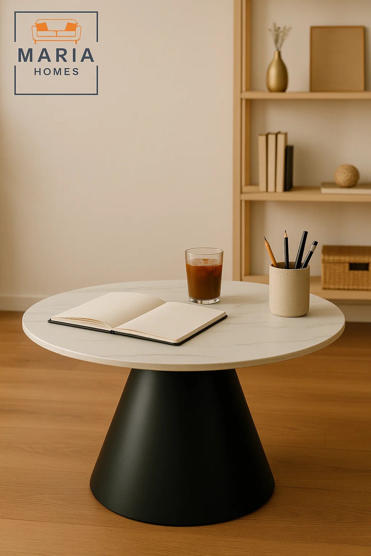 Round white marble table with black cone base