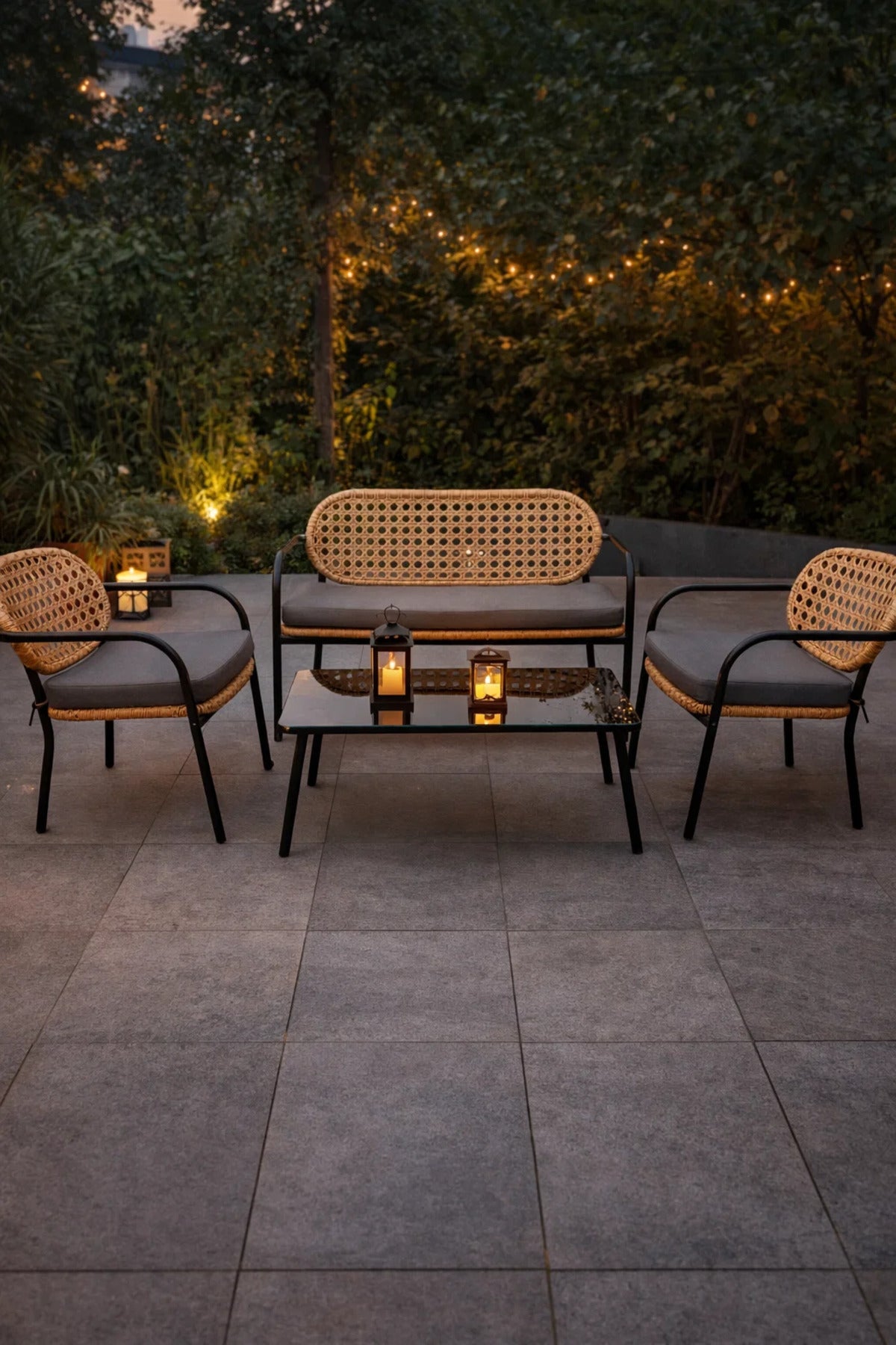 Stylish 4-Piece Wicker Patio Furniture Set with Black Metal Frame Grey Cushions Coffee Table