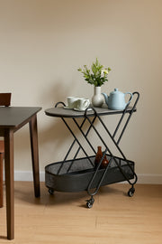 Gray Metal Serving Trolley Ð 2-Tier Industrial Bar Cart with Mesh Basket & Wheels 70_44_85 cm