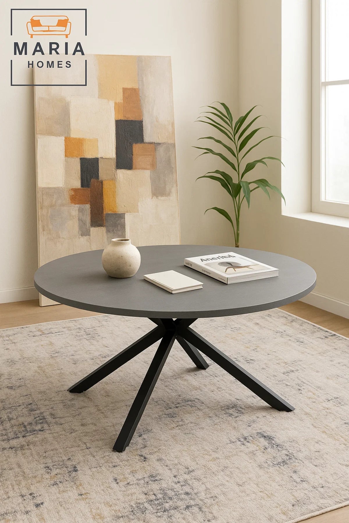Minimalist round stone-look table with black cross base
