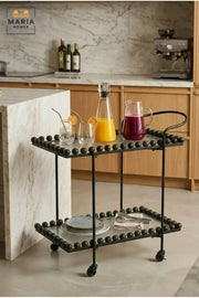 Modern 2-Tier Glass Serving Trolley – Black Rolling Bar Cart with Metal Frame and Decorative Bead Accents