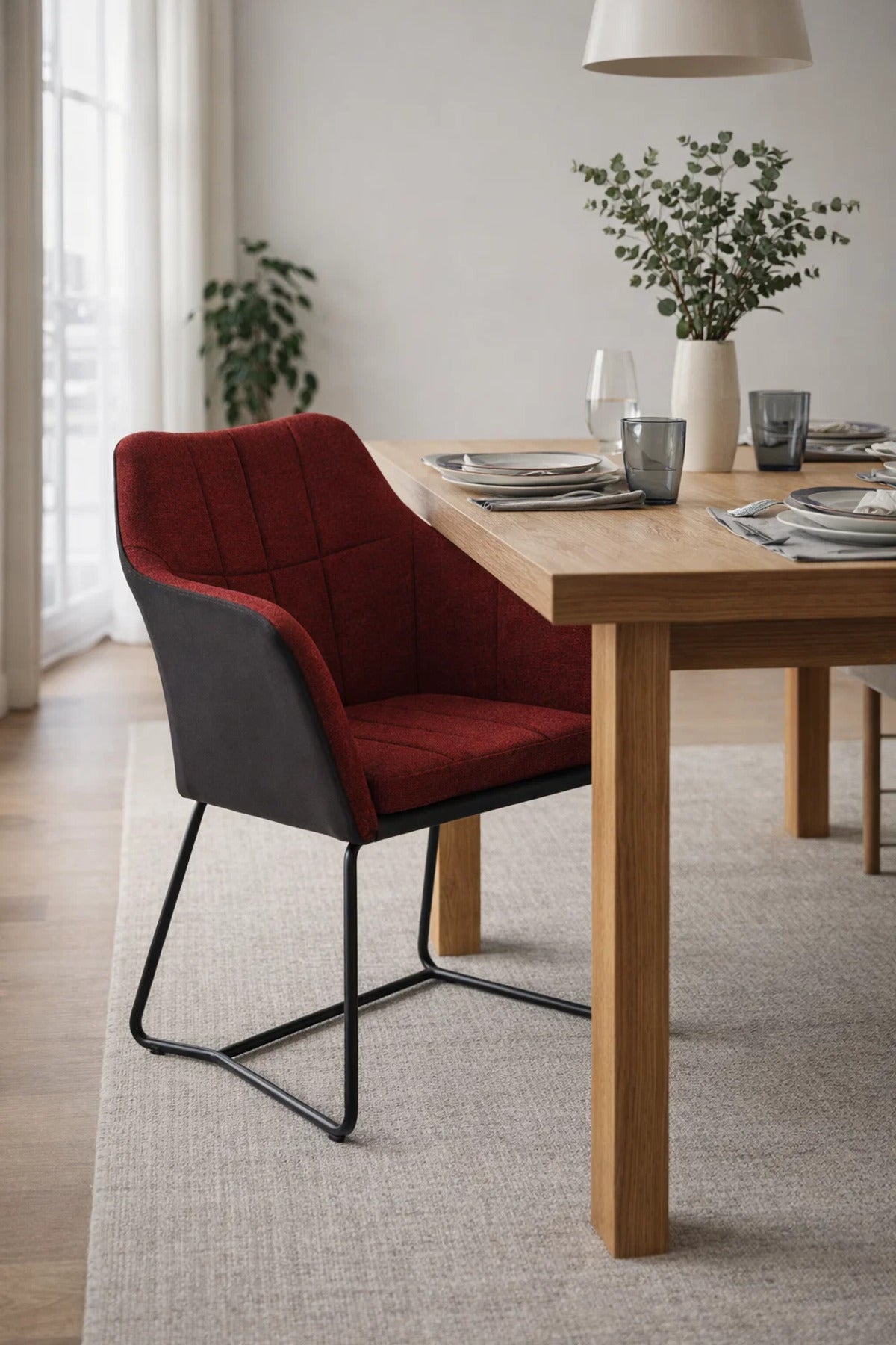 Contemporary Red Upholstered Dining Armchair with Black Leather Shell and Durable Metal Sled Base