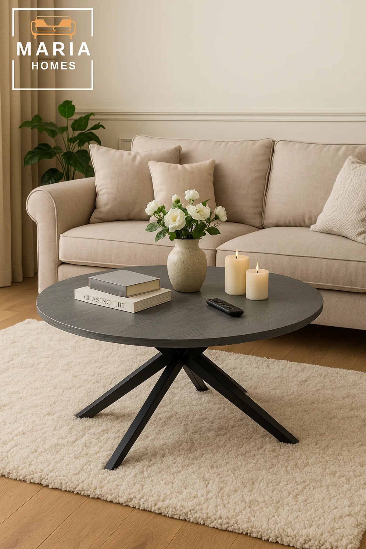 Grey stone round coffee table with angled black metal legs