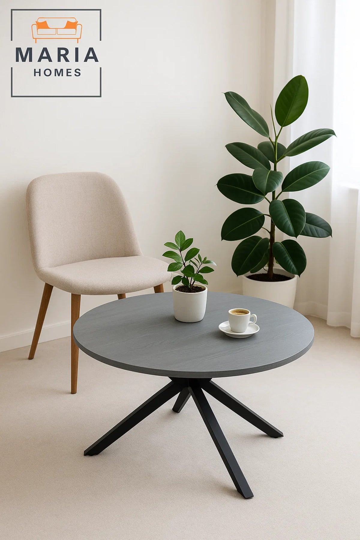 Grey stone round coffee table with angled black metal legs